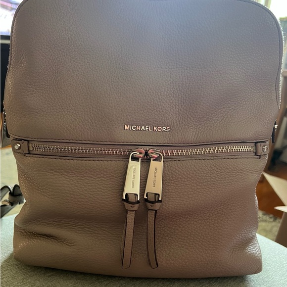 Michael Kors Handbags - Michael Kors Brown Backpack with Structured Design and Metal Hardware